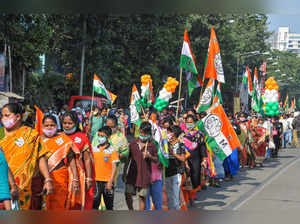 Kolkata: Trinamool Congress supporters participate in an election campaign rally...