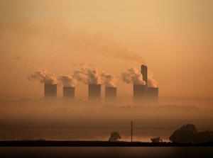 FILE PHOTO: Steam rises at sunrise from the  Lethabo Power Station, a coal-fired power station owned by state power utility ESKOM near Sasolburg