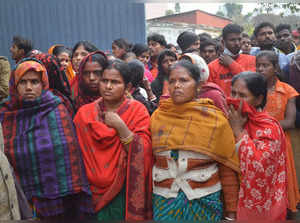 Muzaffarpur: People look on after a boiler explosion at a factory in Bihar's Muz...