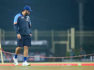 Ranchi: Indian T20 team skipper Rohit Sharma inspects the pitch during team prac...