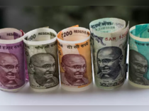 Rupee surges 35 paise vs dollar on year-end exporter activity, firm equities