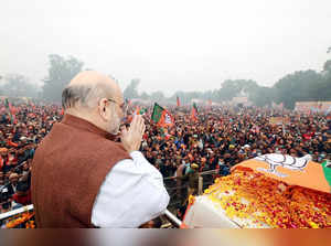 Hardoi, Dec 28 (ANI): Union Home Minister Amit Shah greeting Bharatiya Janata Pa...
