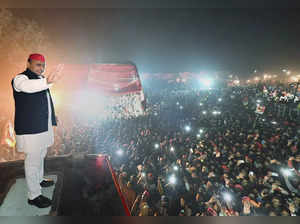 Unnao: Samajwadi Party President Akhilesh Yadav waves towards supporters during ...