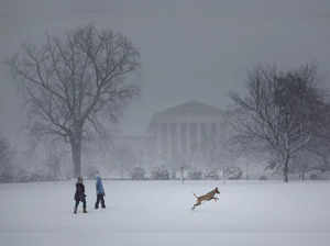Snow falls during a winter storm on Capitol Hill, in Washington