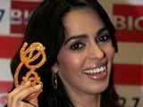 Mallika Sherawat holds a 'jalebi'