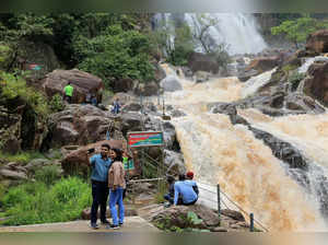 Latehar: Tourists visit the Lodh waterfall near Netarhat in Lathehar district of...