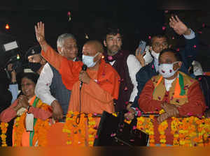 Ghaziabad, Dec 25 (ANI): Uttar Pradesh Chief Minister Yogi Adityanath waves to t...