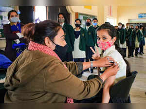Jaipur: School students receive COVID-19 vaccine dose, at a school, in Jaipur. (...