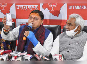 Dehradun: Uttarakhand Chief Minister Pushkar Singh Dhami with State BJP Presiden...