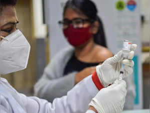 New Delhi: A health worker prepares a dose of COVID-19 vaccine before administer...