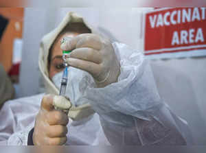 Srinagar: A healthcare worker prepares the booster dose of COVID-19 vaccine befo...