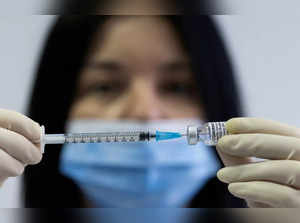 FILE PHOTO: A health worker prepares a syringe with Biontech-Pfizer's Comirnaty vaccine against COVID-19 at the Institute for Health and Food Safety of Zenica
