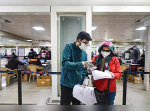 New Delhi: Air travellers check their documents to get themselves registered for...