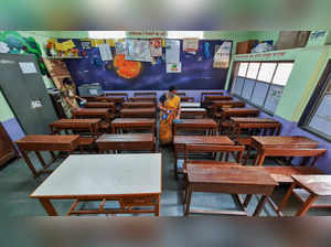 Thane: Staffers clean a classroom at a Municipal Corporation school after the Ma...