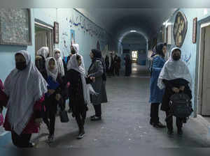 Afghan girls exit classrooms at Tajrobawai Girls High School