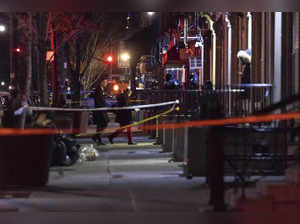 New York:  New York Police officers investigate the scene of a shooting in Harle...