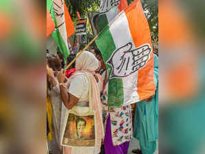 New Delhi: Delhi Pradesh Congress Committee activists hold party flags during th...