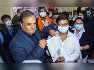 Dibrugrah: Assam CM Himanta Biswa Sarma presents a certificate to a teenager on ...