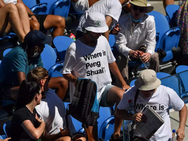 Two spectators wearing 'Where is Peng Shuai' T-shirts,