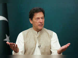 FILE PHOTO: Pakistan's Prime Minister Imran Khan gestures during an interview with Reuters, in Islamabad
