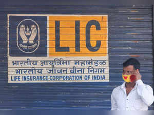 Man speaks on his phone outside the Life Insurance Corporation of India (LIC) office in Mumbai