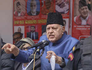 National Conference President Dr. Farooq Abdullah addresses during a pub...
