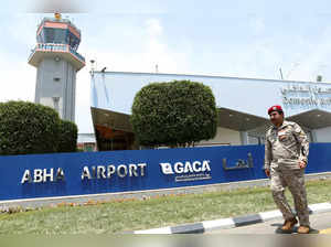 FILE PHOTO: A Saudi security officer walks past the Saudi Arabia's Abha airport, after it was attacked by Yemen's Houthi group in Abha