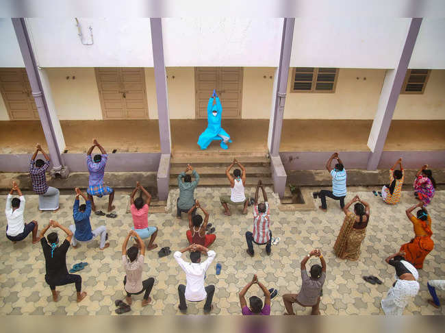 Kanyakumari: COVID-19 patients participate in a yoga session at a COVID care cen...