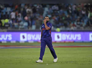 Dubai: India's Mohammed Shami reacts after he was hit by three consecutive bound...