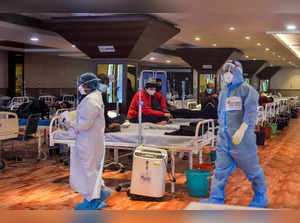 New Delhi: COVID-19 patients undergo treatment inside the Shehnai Banquet Hall, ...