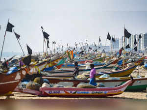 Chennai: Fishermen raise black flag on their boats to mark the 17th anniversary ...