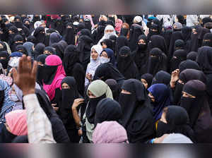 Women wearing hijabs attend a protest against the recent hijab ban in few colleges of Karnataka state
