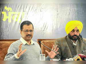 Chandigarh: Delhi Chief Minister & AAP convener Arvind Kejriwal with AAP's chief...