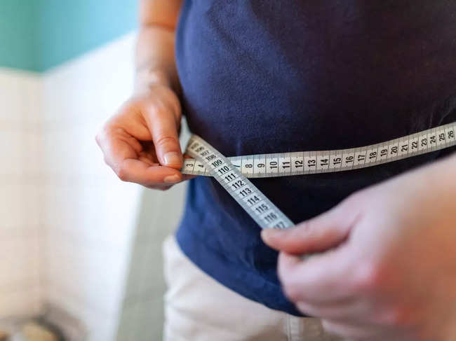 Why does one gain weight during mid-age?