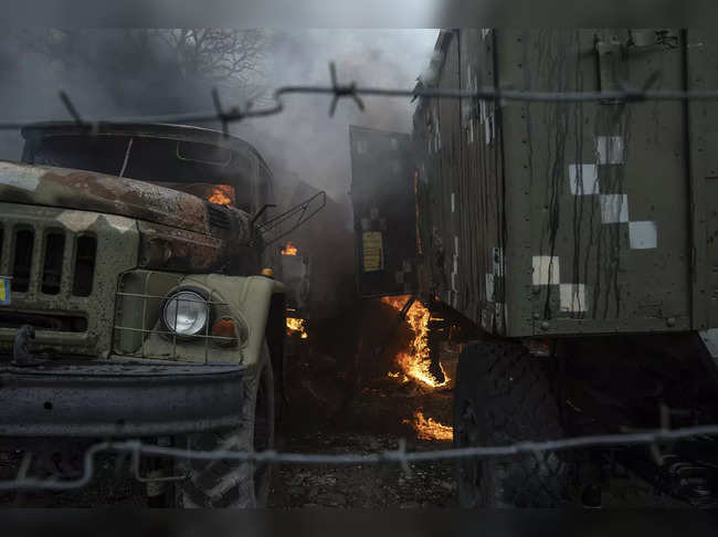 Mariupol : Ukrainian military track burns at an air defence base in the aftermat...