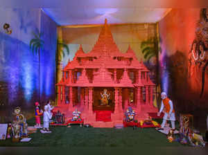 Surat: A devotee makes a replica of Ram Mandir at Ganesh Pandal during celebrati...