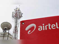 FILE PHOTO: A Bharti Airtel advertisement board is installed against the backdrop of company's telecommunication tower in Kochi