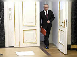 Moscow : Russian President Vladimir Putin enters a hall to chair a Security Coun...
