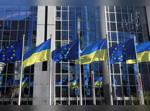 Flags of European Union and Ukraine flutter outside EU Parliament building, in Brussels