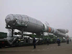 A Soyuz rocket booster with satellites of British firm OneWeb is transported to a launchpad at the Baikonur Cosmodrome