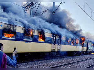 Meerut: Flames rise after a fire broke out in the Saharanpur-Delhi passenger tra...