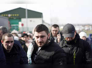 People flee violence in Ukraine for Polish border crossing, in Medyka