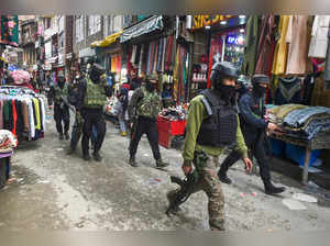 Security personnel after a grenade blast
