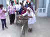 UP Polls Phase 7: Elderly man carries wife on pulling cart to cast vote in Azamgarh