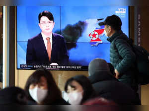 People watch a TV broadcasting a news report on North Korea's firing a ballistic missile off its east coast, in Seoul