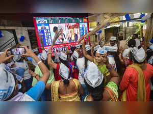 Mumbai: Aam Aadmi Party (AAP) workers celebrate their party's lead during counti...