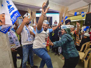 Mumbai: Aam Aadmi Party (AAP) workers celebrate their party's lead during counti...