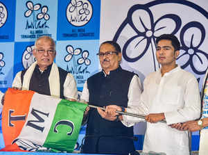 Kolkata: All India Trinamool Congress General Secretary Abhishek Banerjee (R) ha...