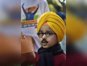 New Delhi: A child dressed as Aam Aadmi Party (AAP)'s Punjab CM candidate Bhagwa...