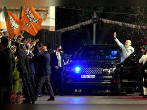 New Delhi: Prime Minister Narendra Modi waves at BJP workers during celebrations...